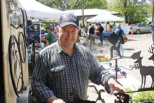 Rob Harrop of Tod Enterprises, one of the many new vendors at the first official outdoor market day at the Sharbot Lake Farmers Market at Oso Beach in Sharbot Lake